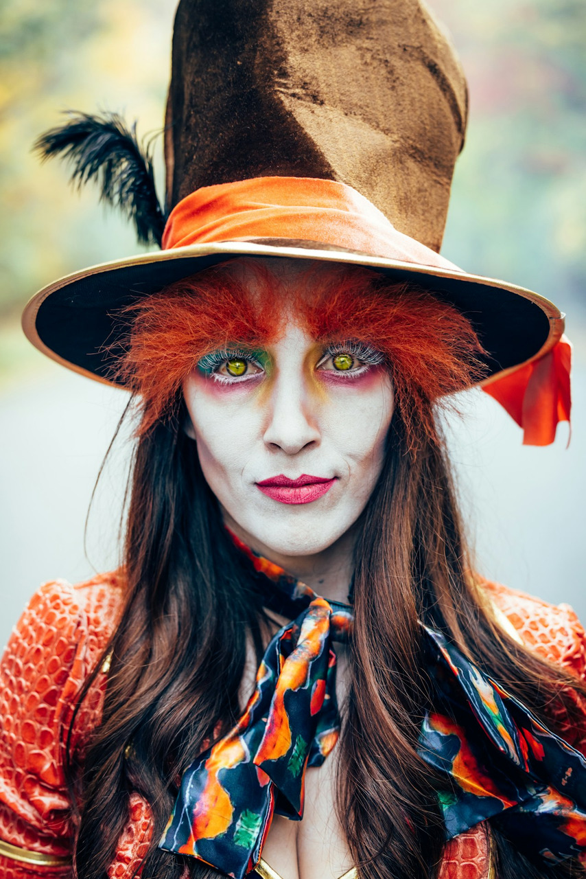 A person in mad hatter costume with elaborate makeup, Ultra