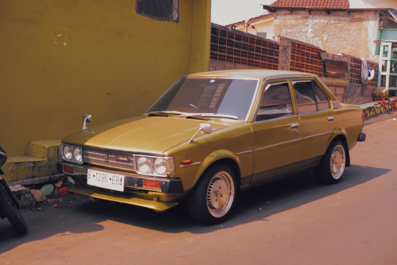 a yellow car parked on the side of the road, Ultra
