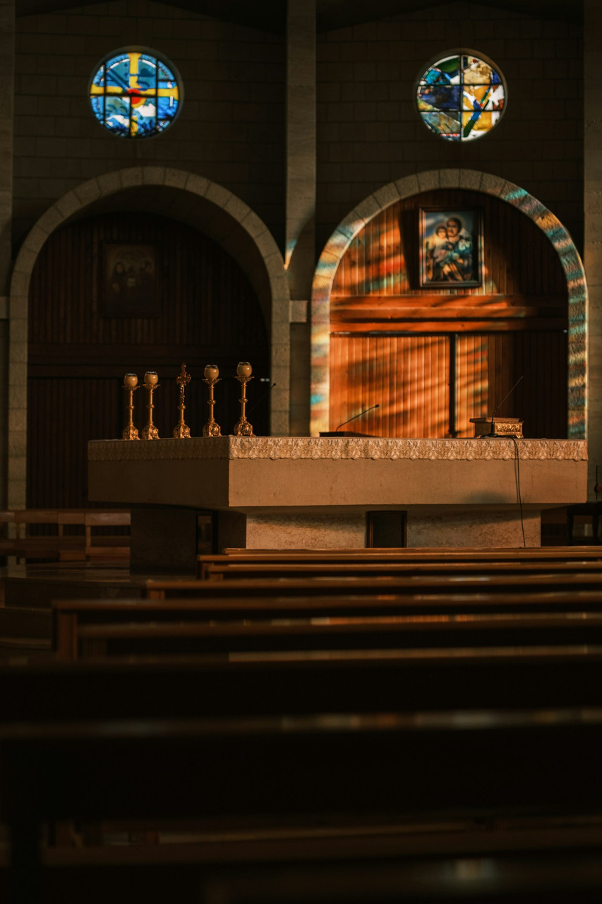 Altar and pews inside a dimly lit church, Ultra