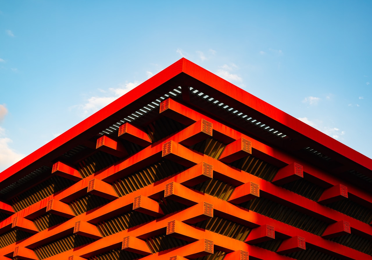 Angular red building architecture under blue sky, Ultra