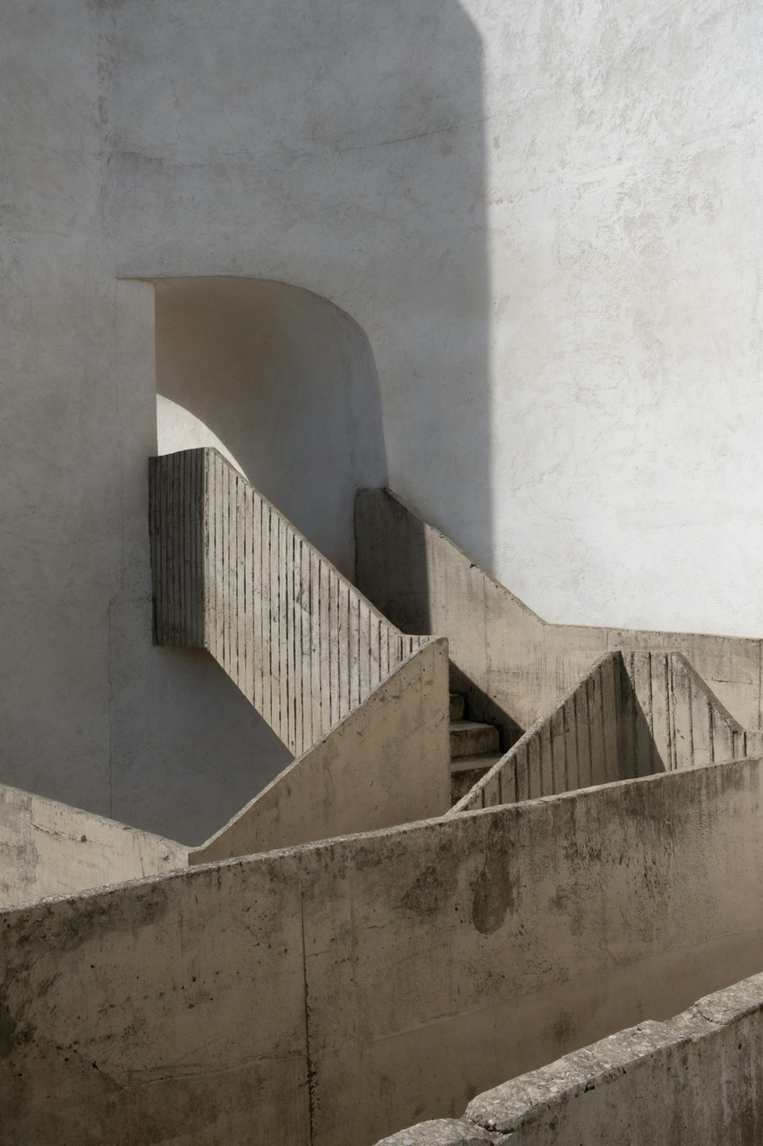 Geometric concrete stairs cast shadows in sunlight, Ultra