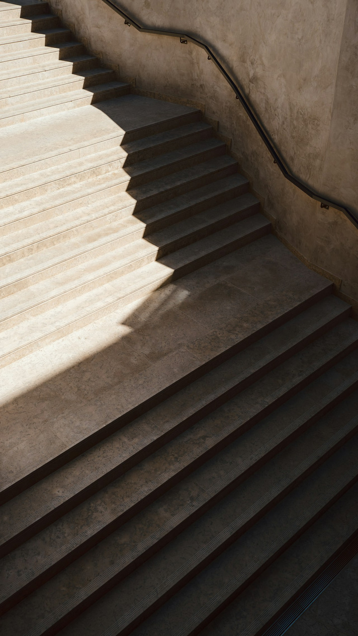 Shadow and sunlight cast upon a concrete staircase, Ultra